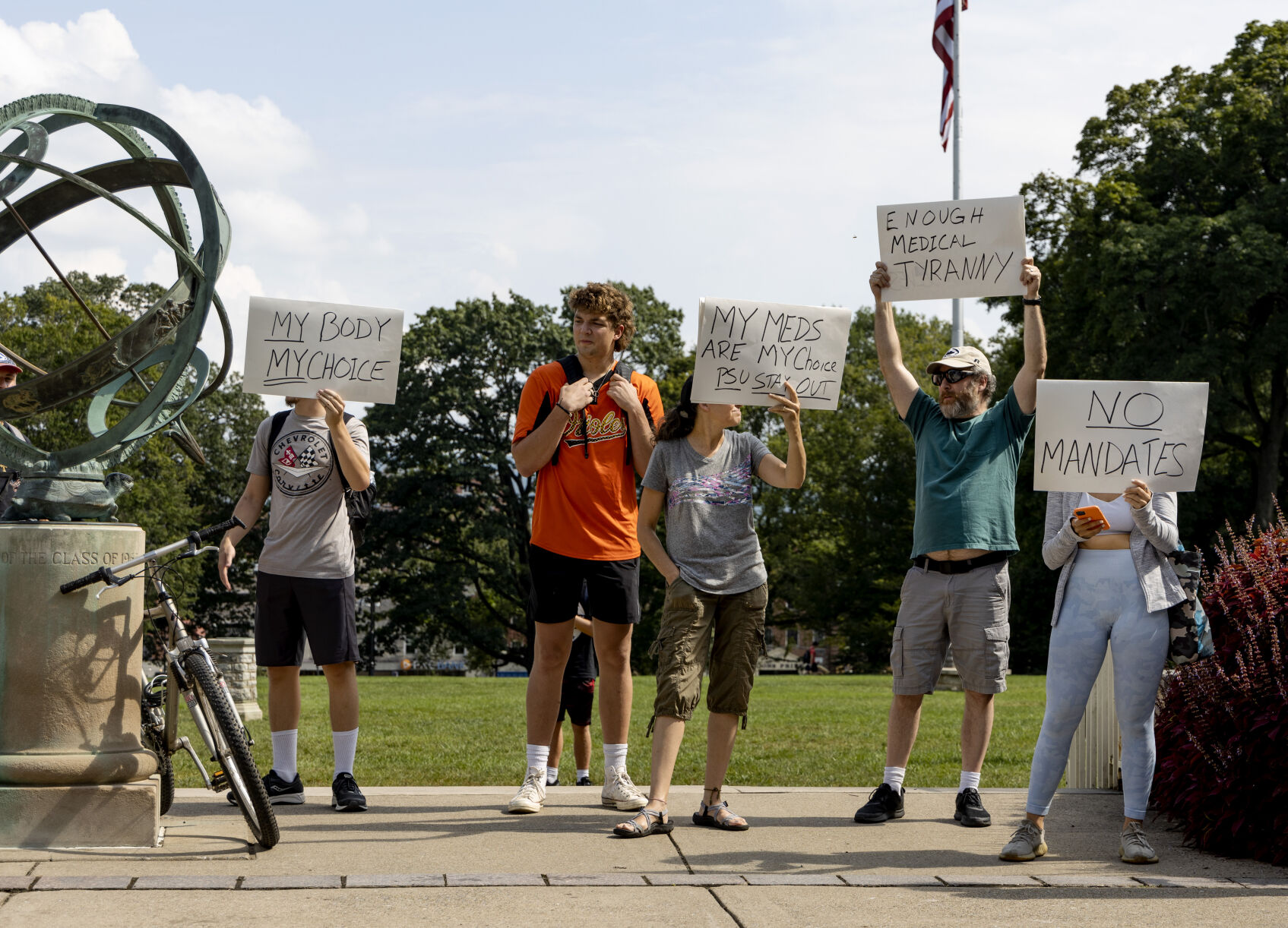 Rally to Vaccinate Penn State, counter protest signs